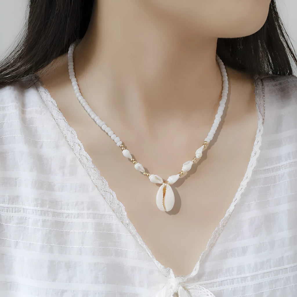 White women's necklace with a natural mother-of-pearl shell pendant on a regular chain.