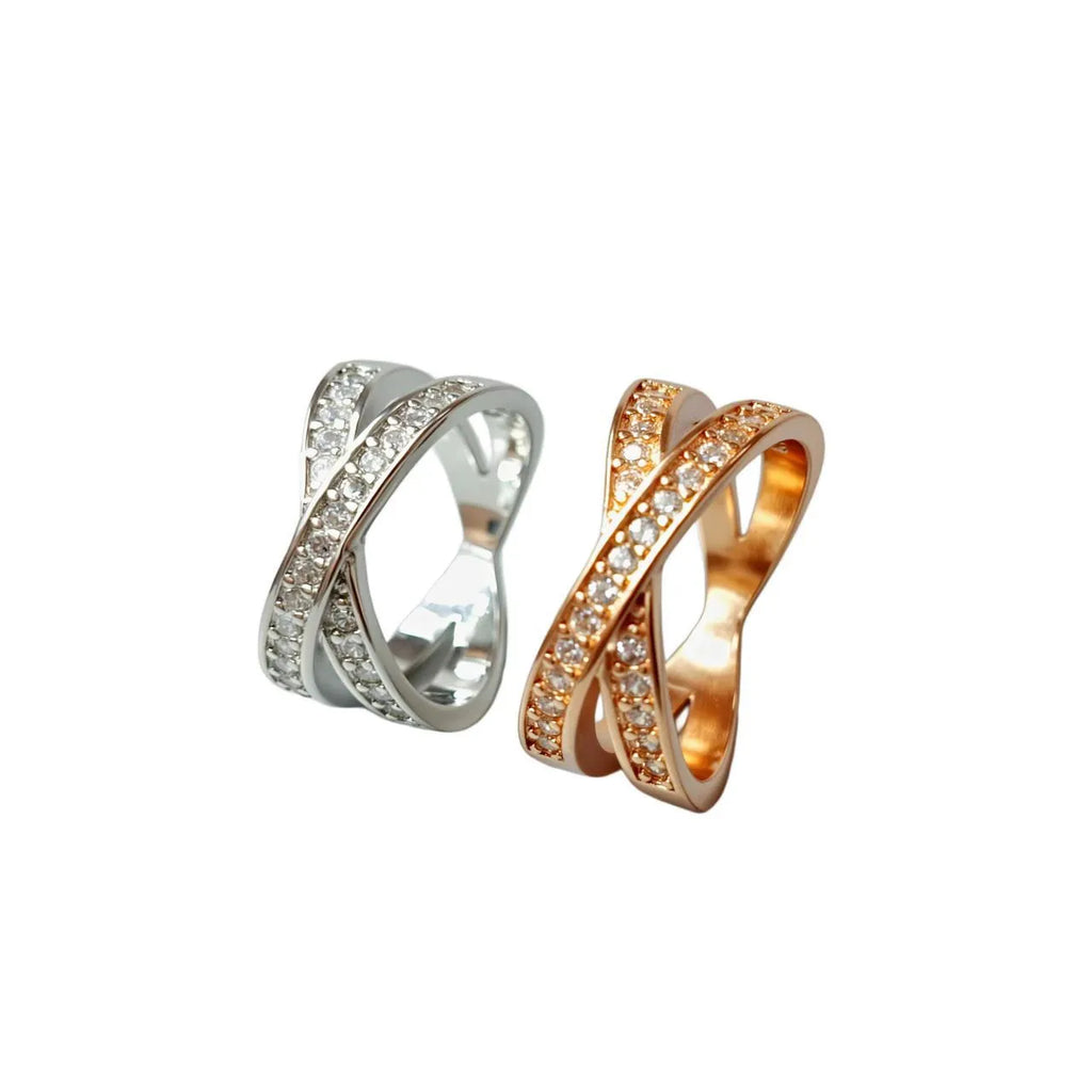 Silver and rose gold metal ring with a small cross design featuring micro-inlaid zircon stones.