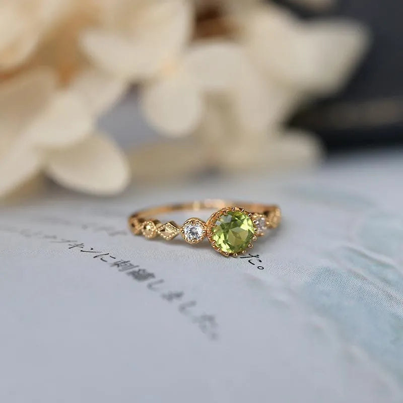 Japanese style geometric copper ring with imitation peridot centrepiece in quadrilateral design