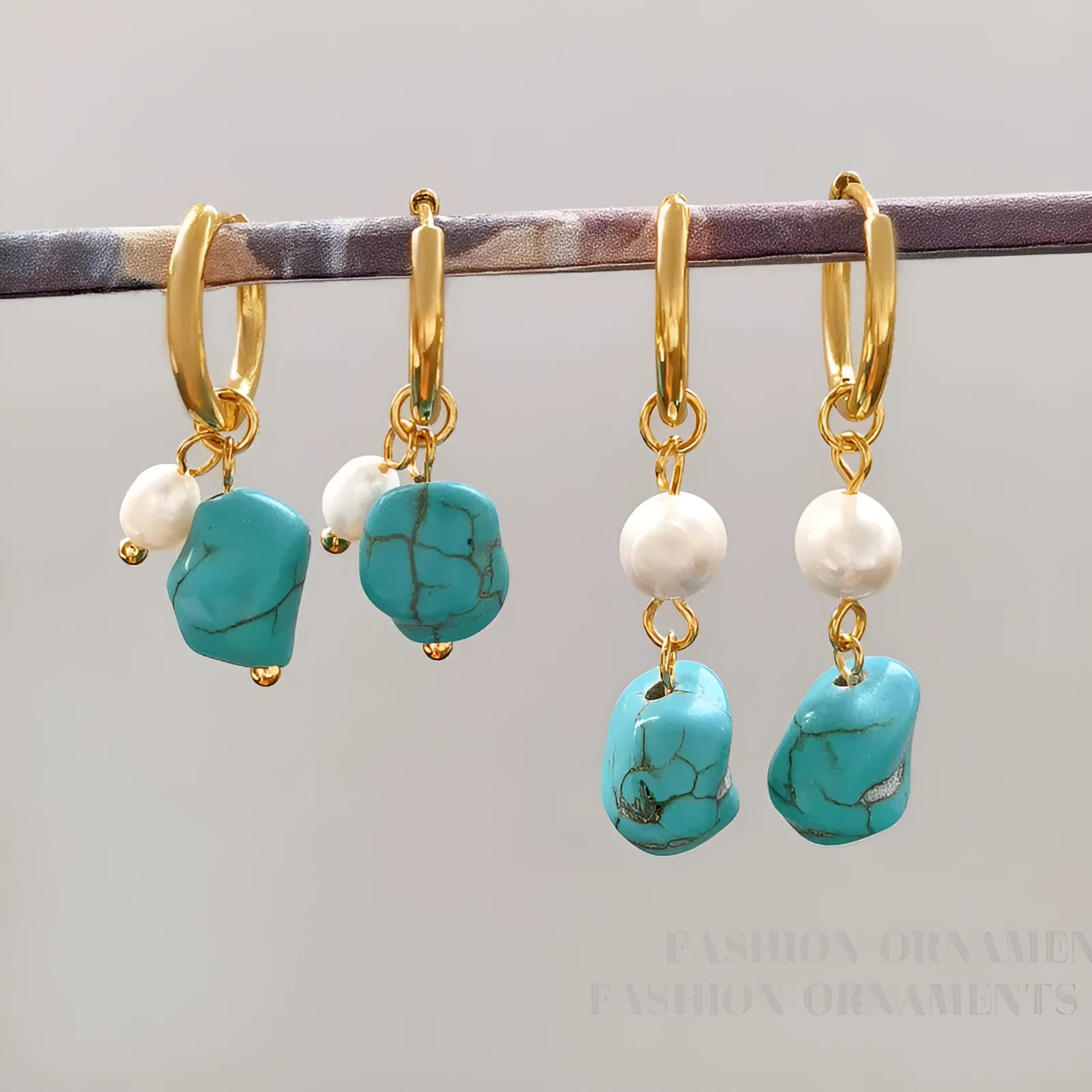 A pair of turquoise and cultured pearl clip-on earrings with irregular geometric copper shapes, showing both long and short styles.