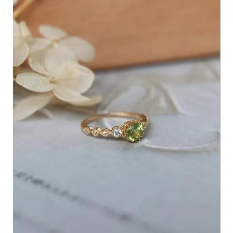 Japanese style geometric copper ring with imitation peridot centrepiece in quadrilateral design