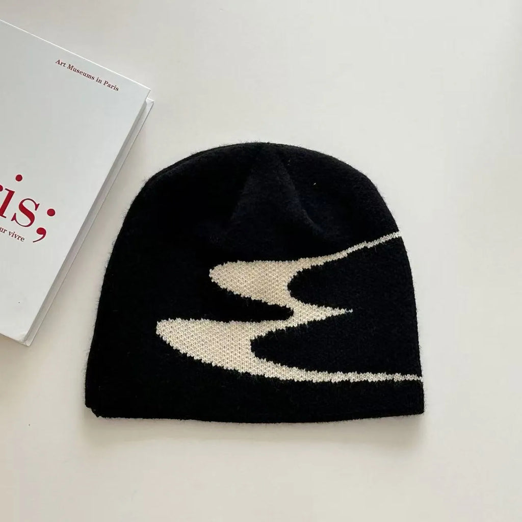 Acrylic thermal beanie hat in white colour showing woolen-style knitting texture