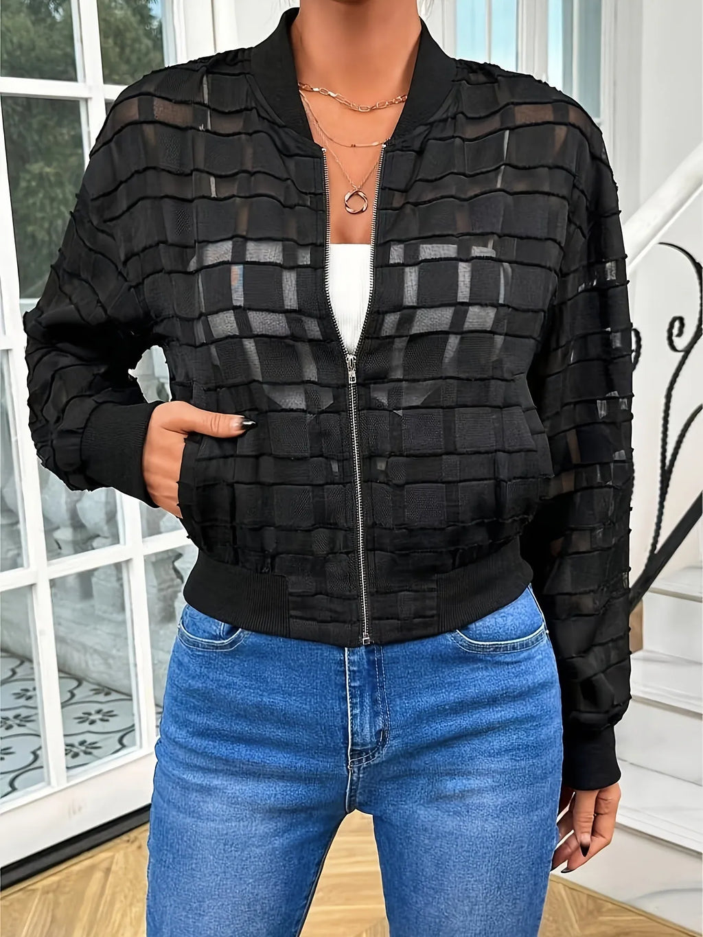 Black women's casual jacket with geometric pattern, front zipper, and long sleeves