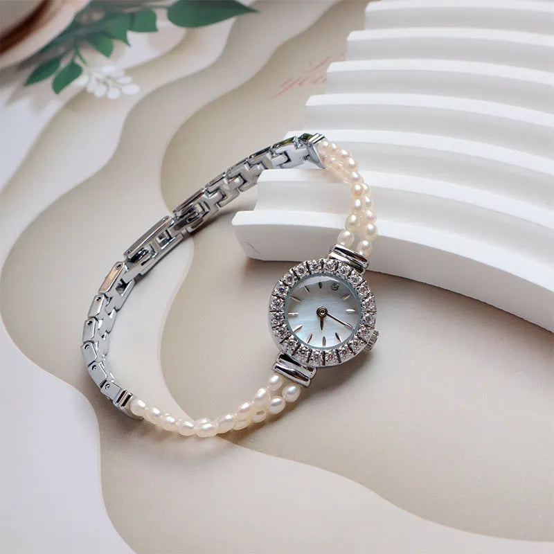 Women's light gold bracelet watch with freshwater pearls and 18mm mineral glass dial