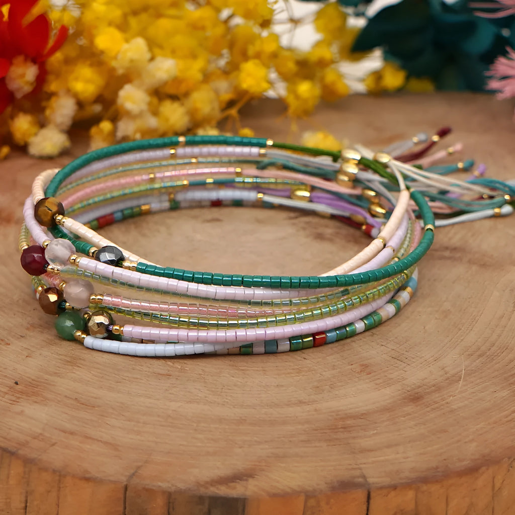 Handmade Bohemian-style women's bracelet with semi-precious stone and colourful glass beads on a wrist.