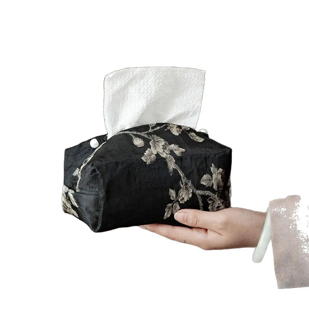 Chinese brocade fabric tissue box with embroidered white plum design, shown with and without a pearl buckle.