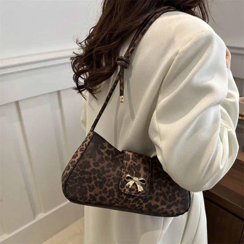 Women's casual PU handbag with sandwich pockets in black colour showing 27cm width
