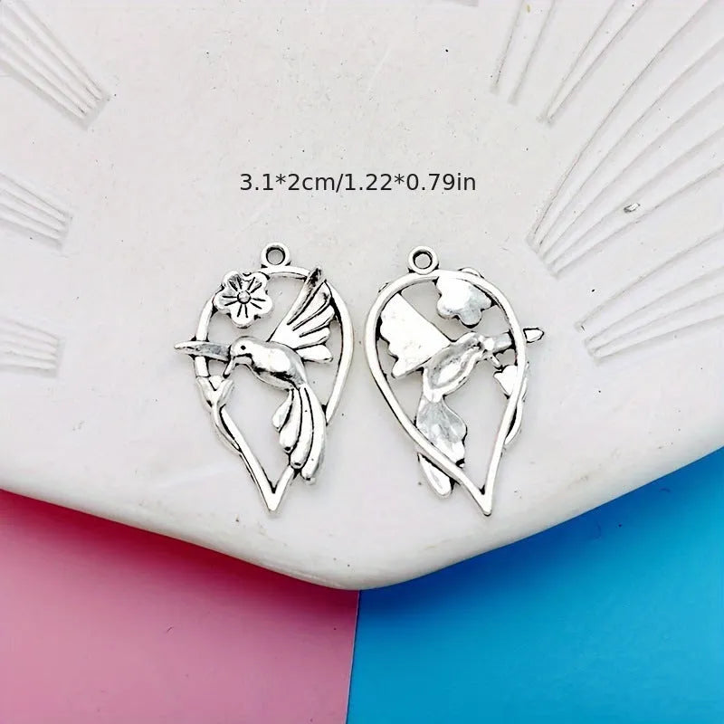Gold-coloured alloy magpie bird charm pendant for DIY necklace or bracelet making.