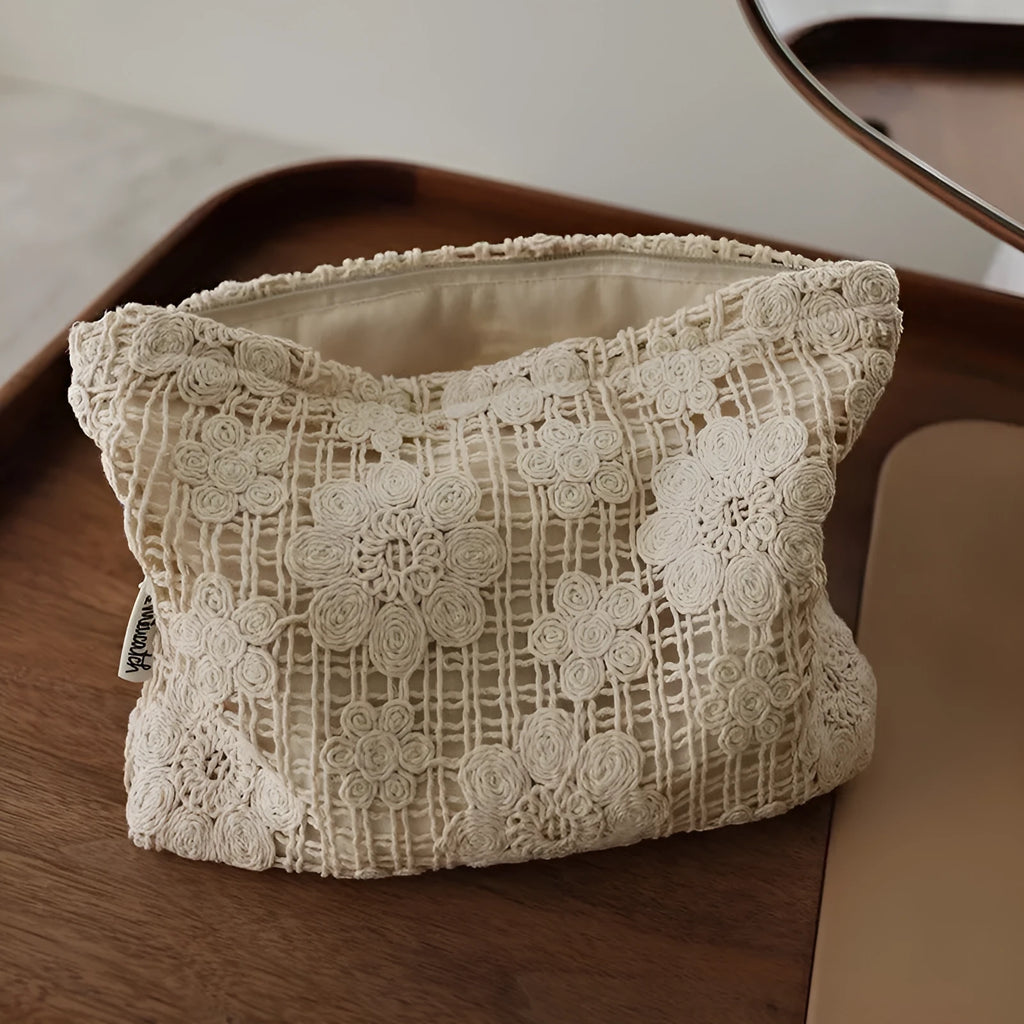 Handmade crocheted hollow flower cosmetic bag in corduroy with ethnic embroidery, solid rope colour.