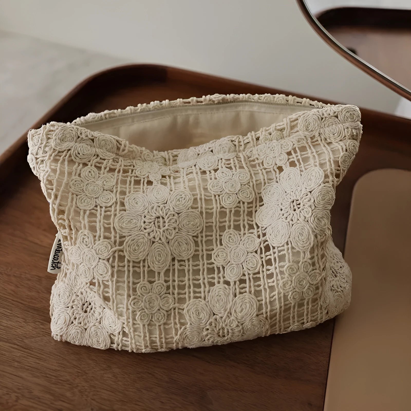 Handmade crocheted hollow flower cosmetic bag in corduroy with ethnic embroidery, solid rope colour.