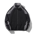 Men's black casual jacket with contrast stitching and side pockets, laid flat.
