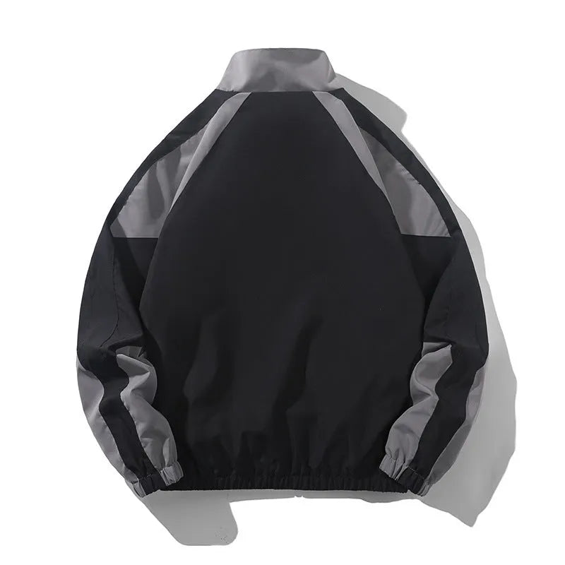 Men's black casual jacket with contrast stitching and side pockets, laid flat.