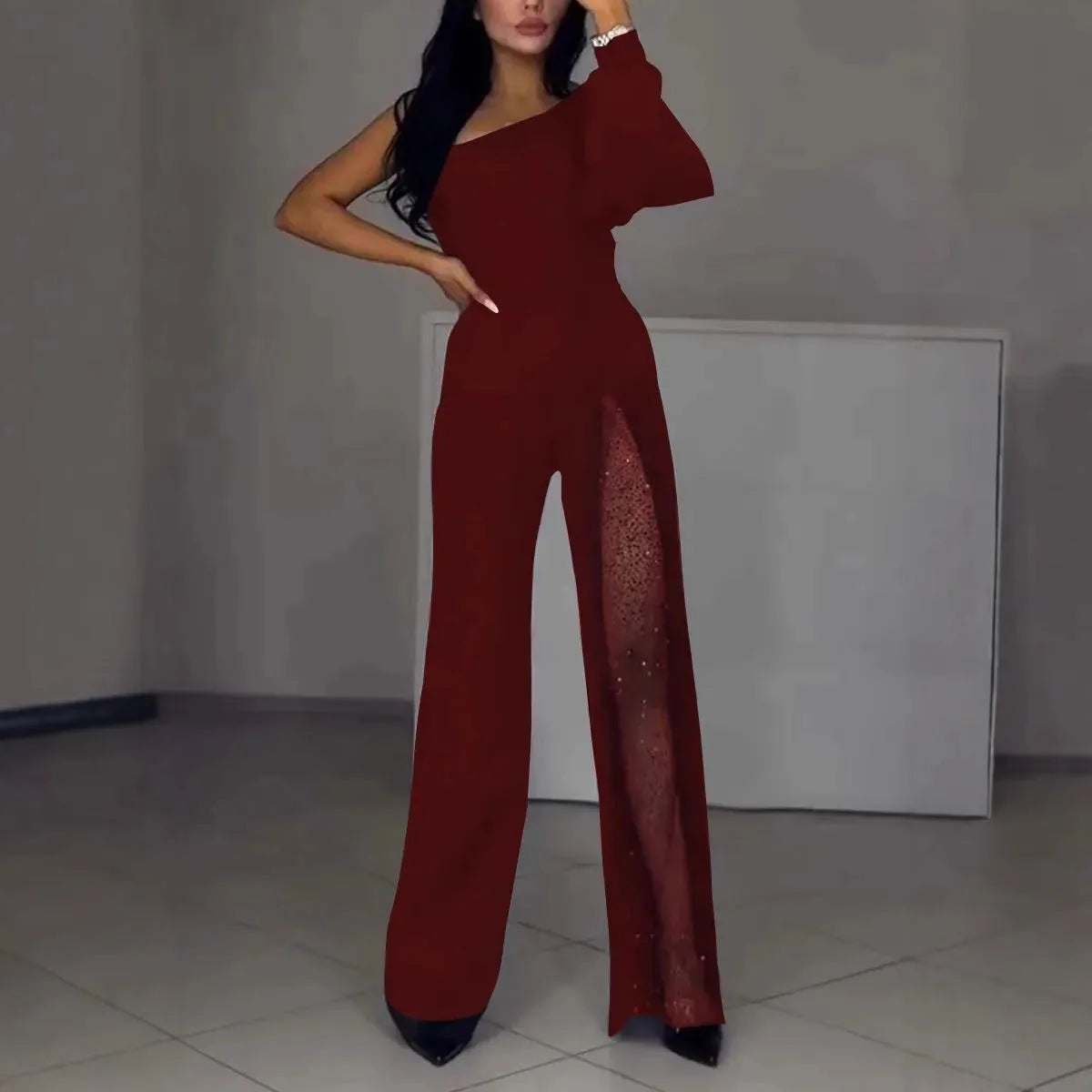 Women's black oblique shoulder jumpsuit with thigh slit and long sleeves for fall winter fashion