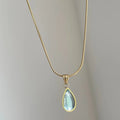 Water drop necklace with snake bones chain and mixed gem pendant in blue or green