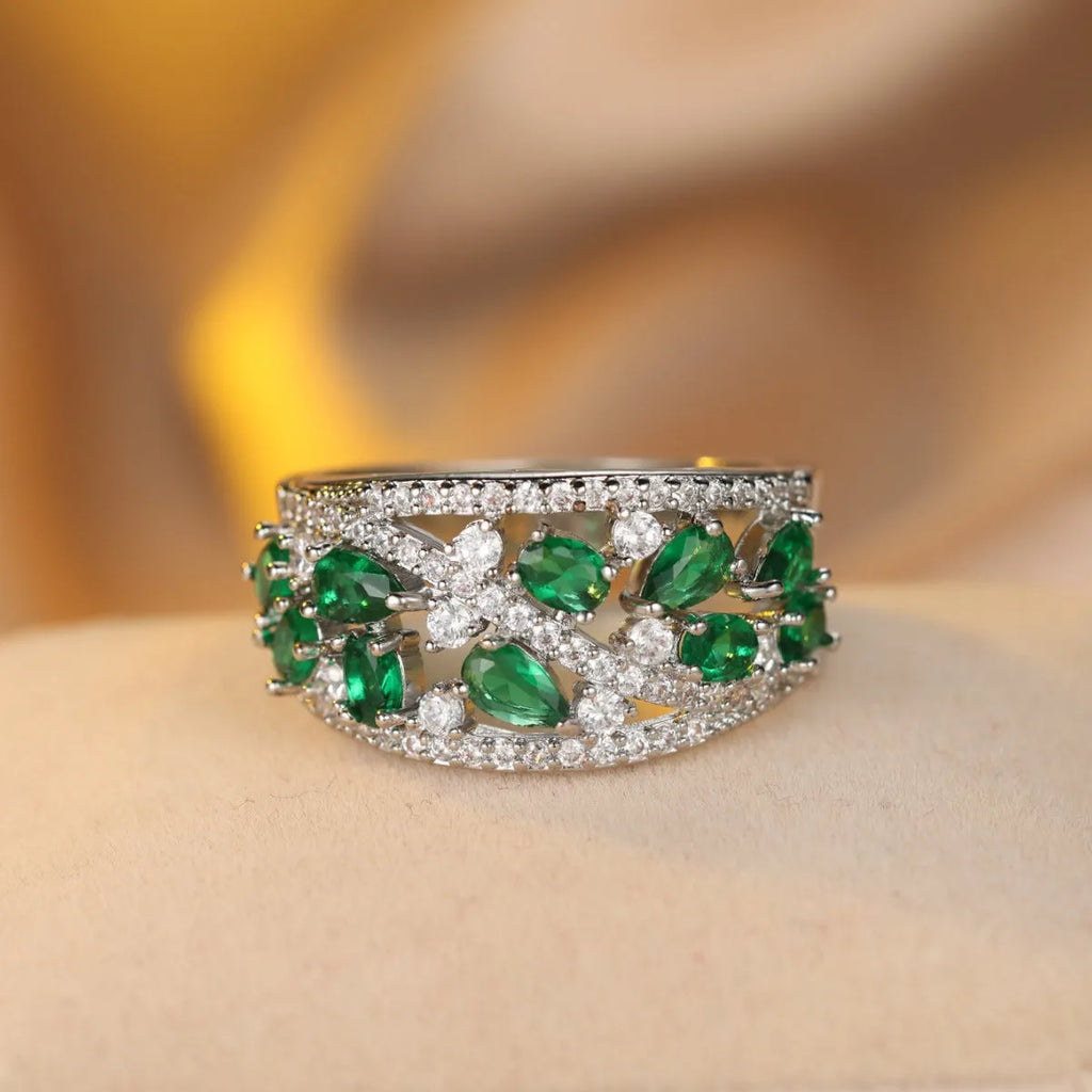 Women's hollow round copper fashion ring shown in gold and platinum colour finishes with a sizing chart.