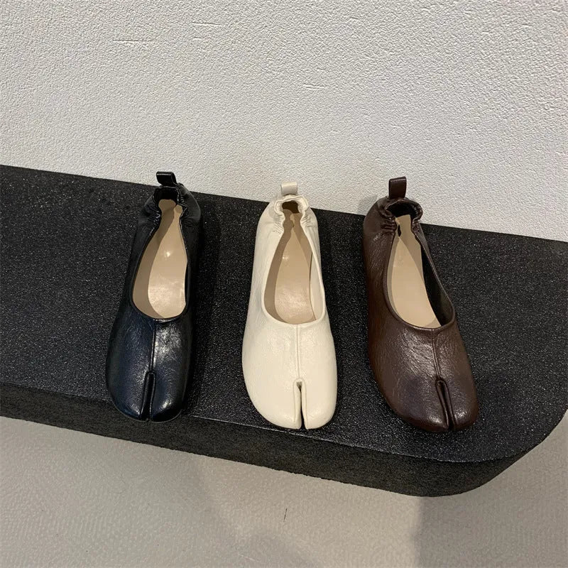 Women's black split toe horseshoe chunky heel pumps with rounded toe and rubber sole