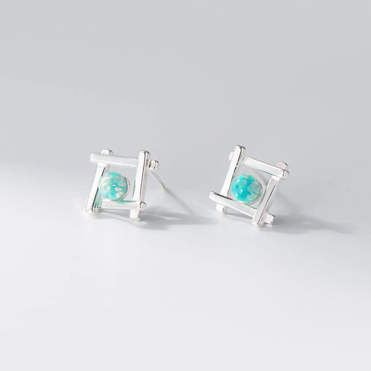 Geometric cross quadrangle stud earrings in 925 silver with silver or gold finish