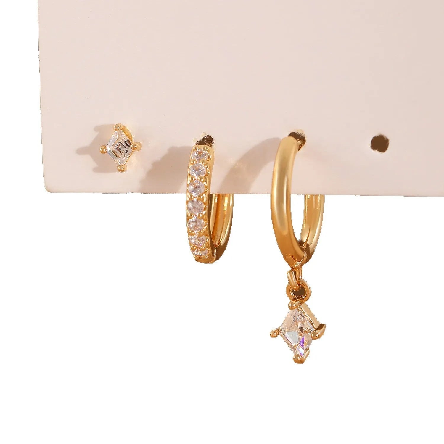 Geometric zircon earring three-piece set showing ear ring, stud, and clasp in gold and silver colours