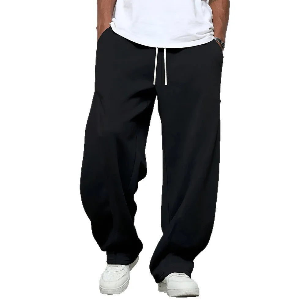 Men's solid colour straight leg casual trousers with a drawstring waistband.