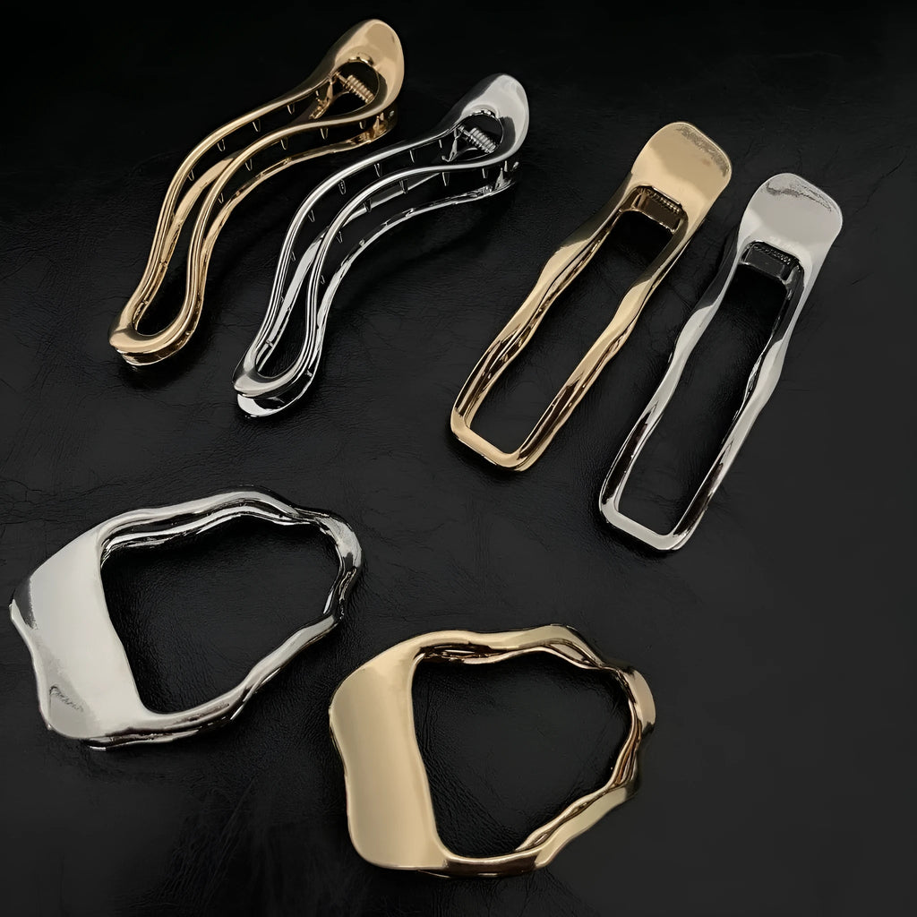 Women's zinc alloy hair barrette in gold colour with a triangle geometric design.