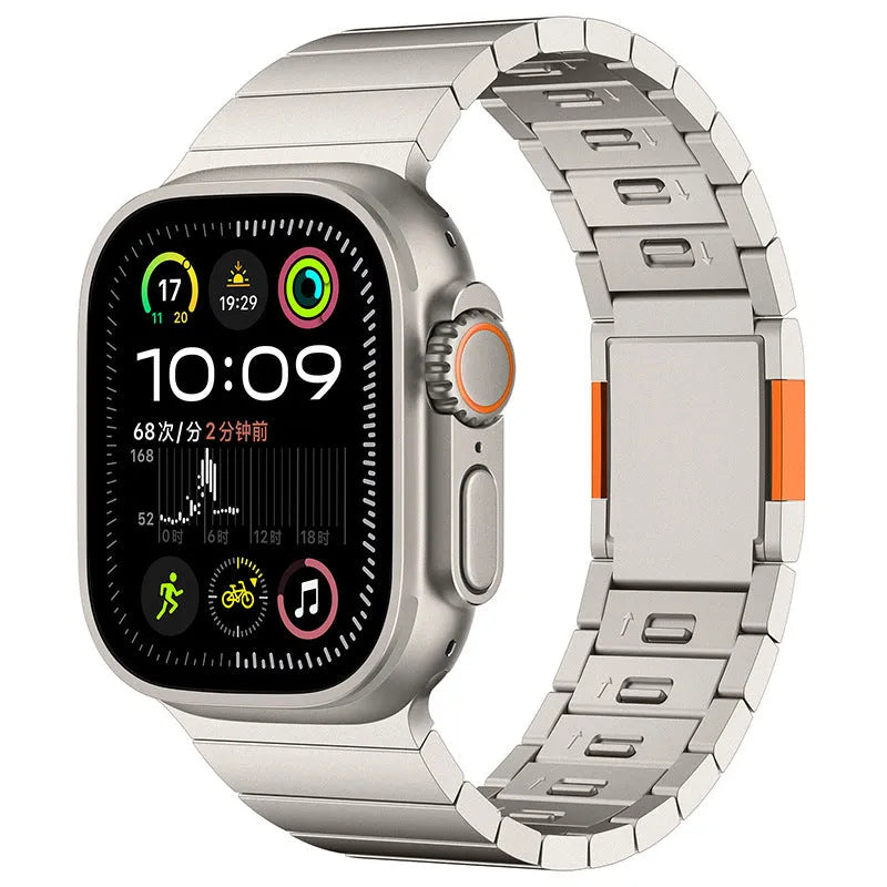 Stainless steel Apple Watch strap with magnetic fold-over buckle in silver colour.