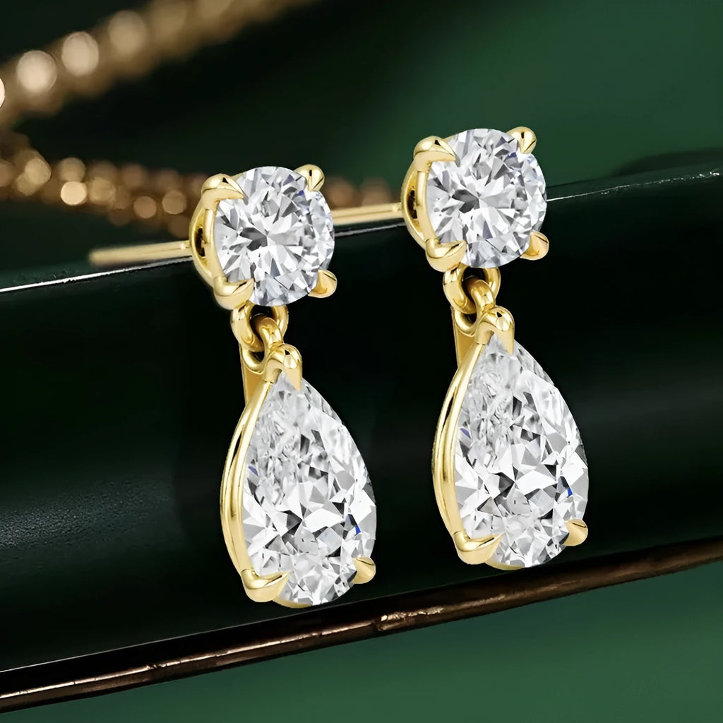 Sterling silver water drop moissanite stud earrings with round and elongated stones in gold and silver plating options