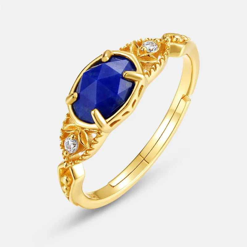 Geometric silver ring with deep blue lapis lazuli stone, elliptical shape with round decorative elements