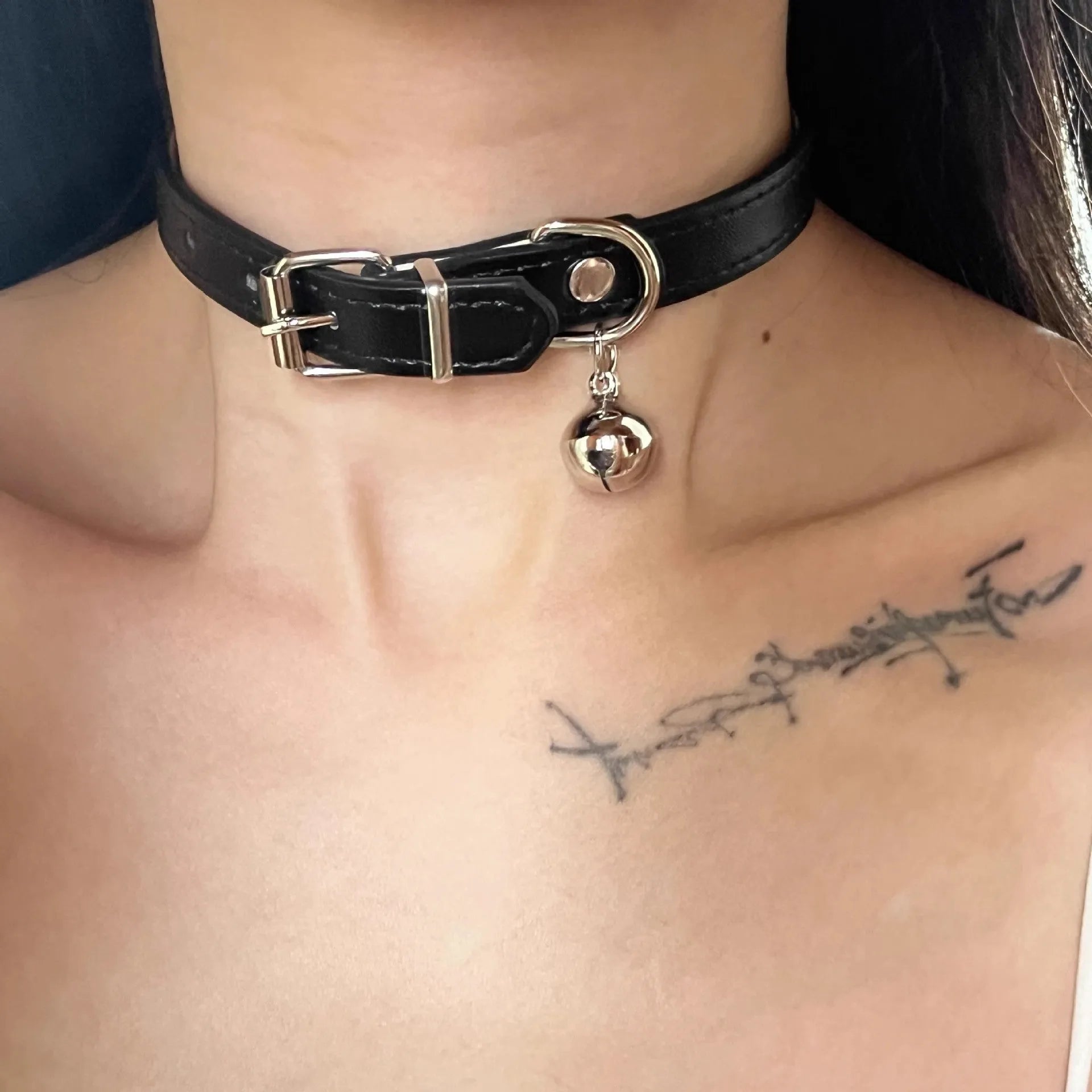 Black adjustable dog collar with regular chain showing cat paw, bone, and leather design options