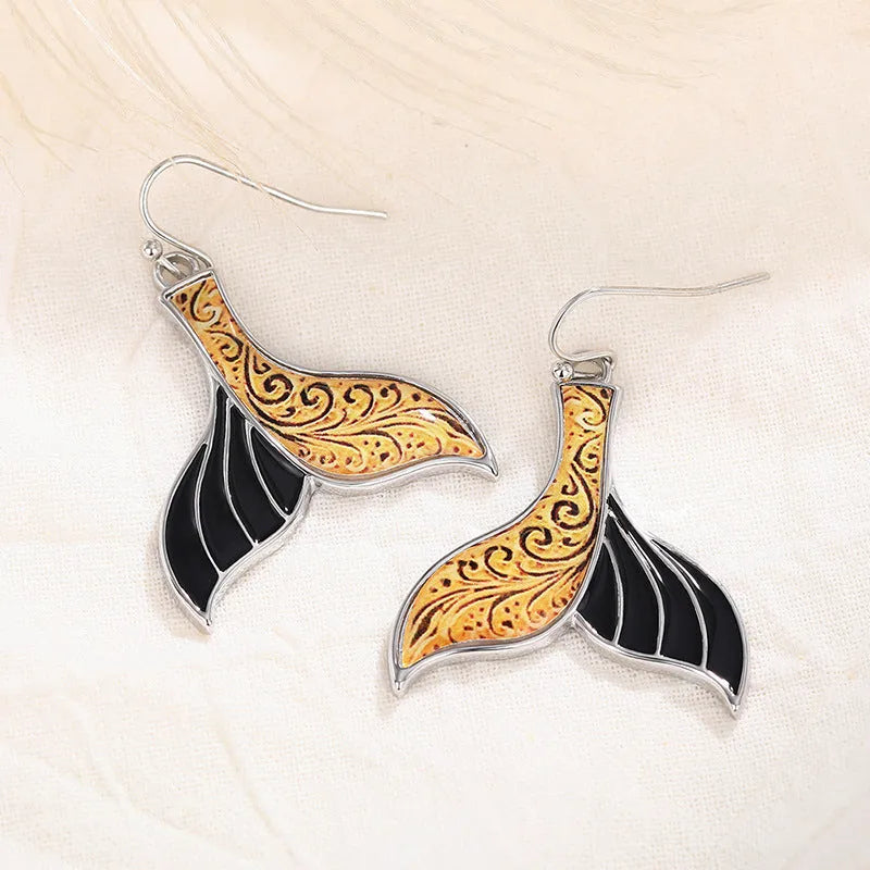 Women's fishtail shaped earrings with whale design in white gold colour alloy