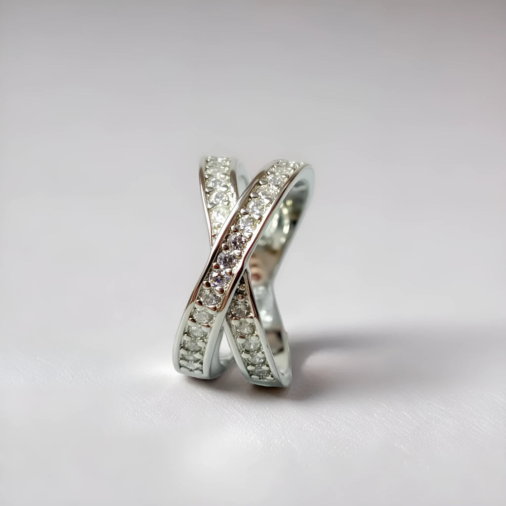 Silver and rose gold metal ring with a small cross design featuring micro-inlaid zircon stones.