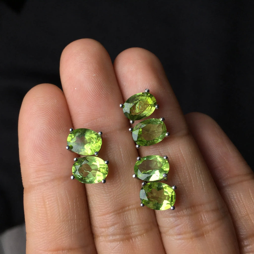 Natural olivine stud earrings in grass green set in S925 silver with 6×8mm oval faceted stone