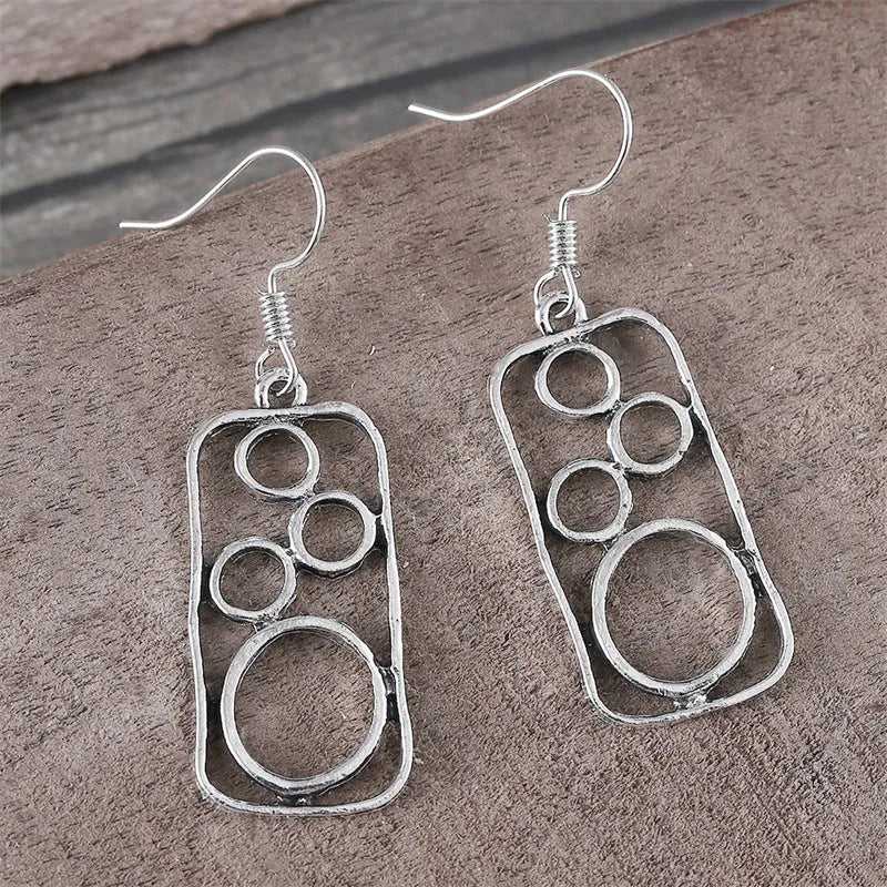 Geometric round earrings with irregular square design in antique silver finish