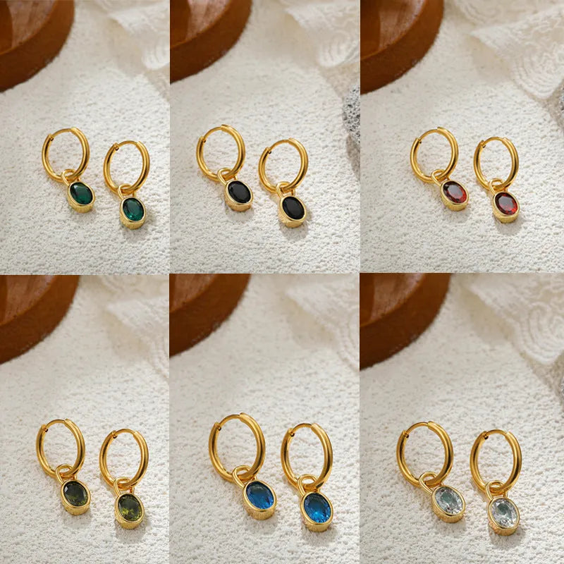 Women's oval zircon earrings in copper on a post, shown in army green colour.