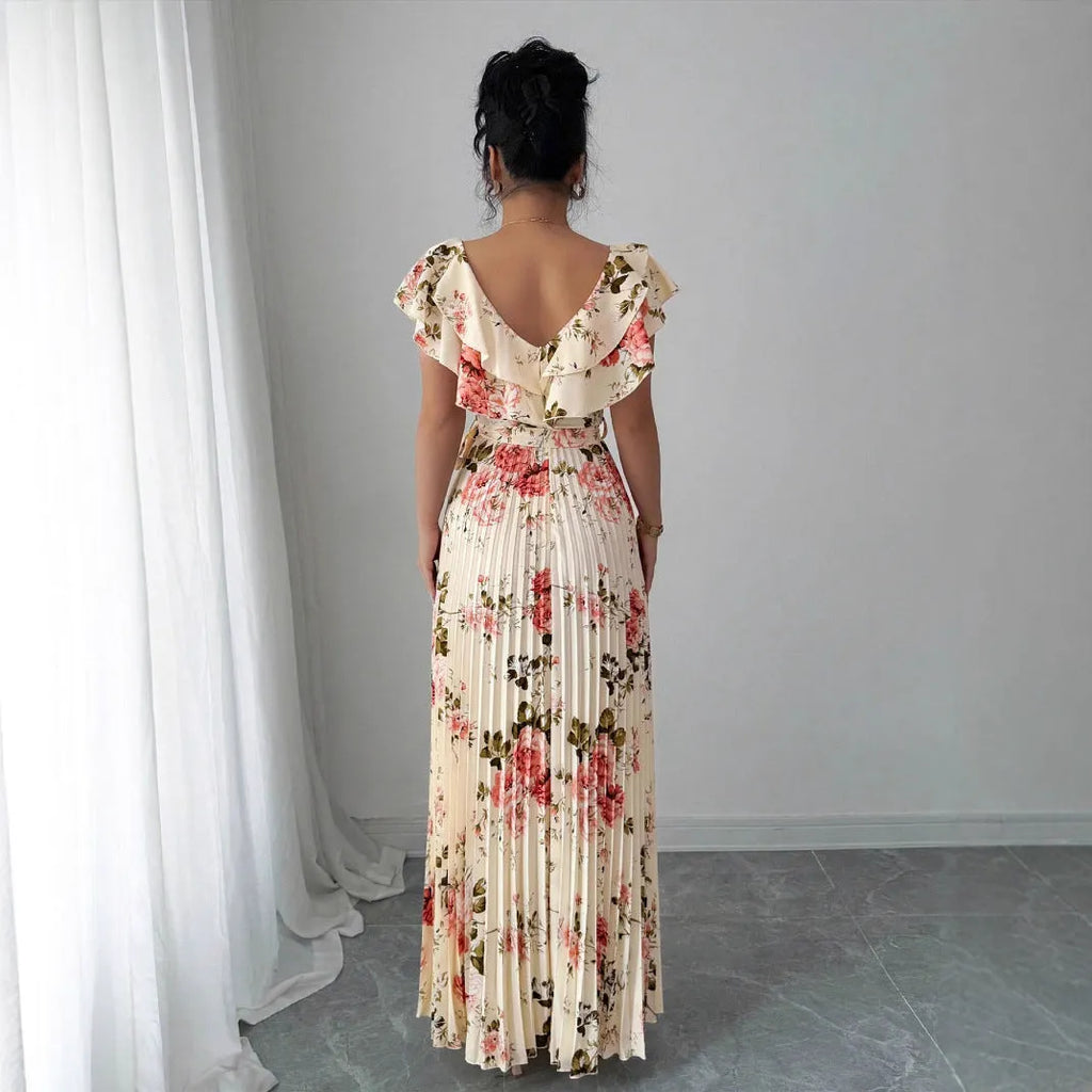 Apricot floral print V-neck dress with ruffled short sleeves and a long, flowing swing skirt.