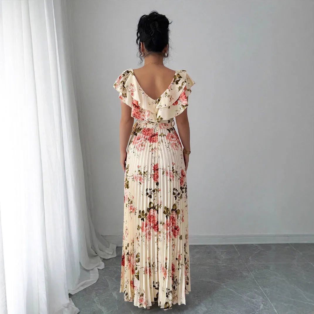 Apricot floral print V-neck dress with ruffled short sleeves and a long, flowing swing skirt.