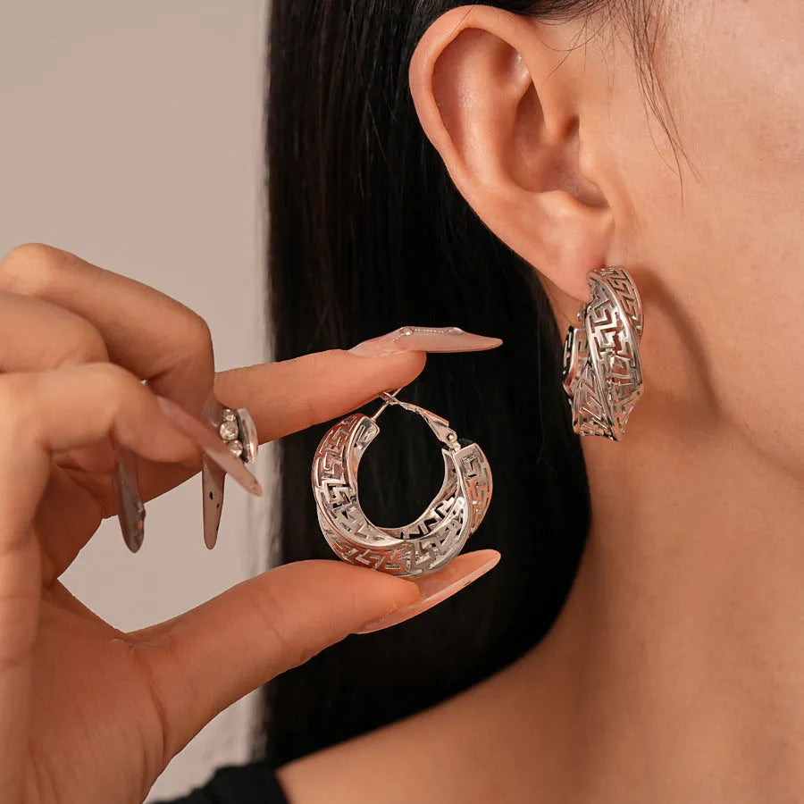 Women's geometric stud earrings with twisted round design in gold and silver electroplated copper