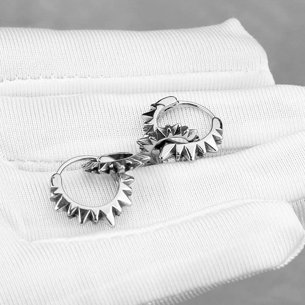 Pair of stainless steel round hoop earrings with polished steel finish, retro European American style