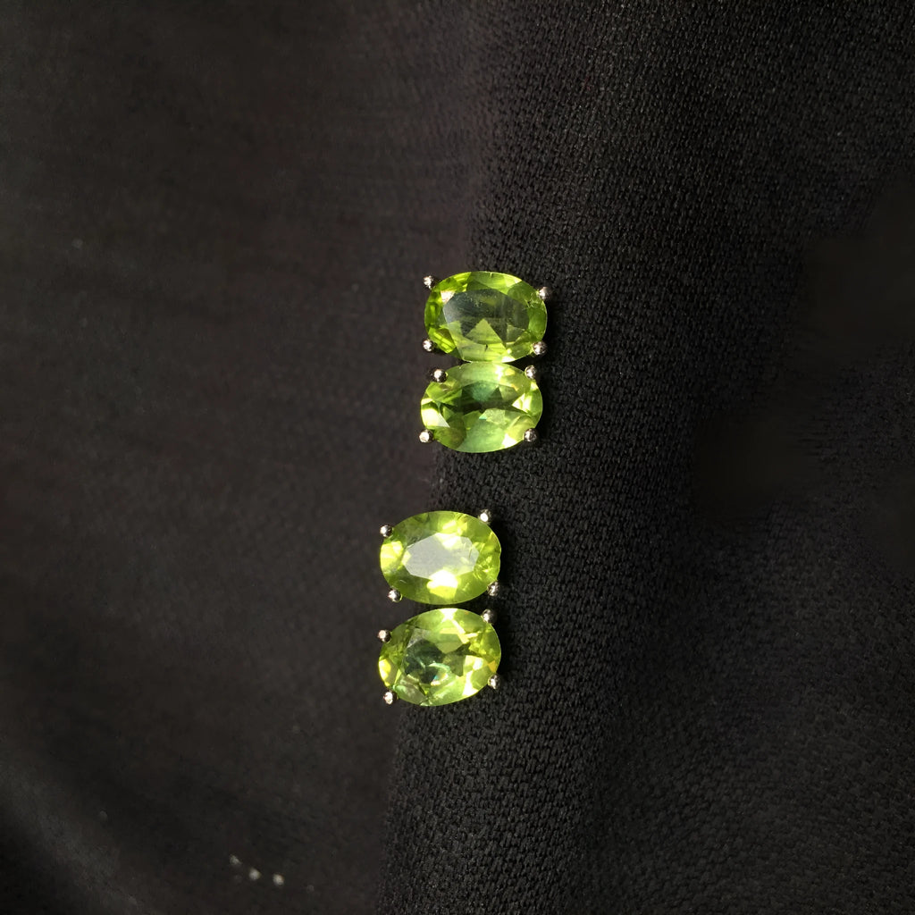 Natural olivine stud earrings in grass green set in S925 silver with 6×8mm oval faceted stone