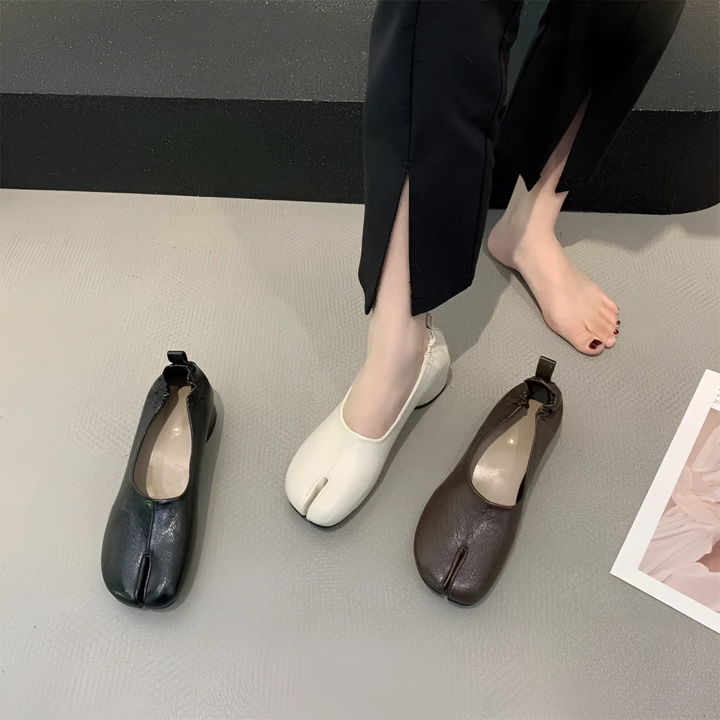 Women's black split toe horseshoe chunky heel pumps with rounded toe and rubber sole
