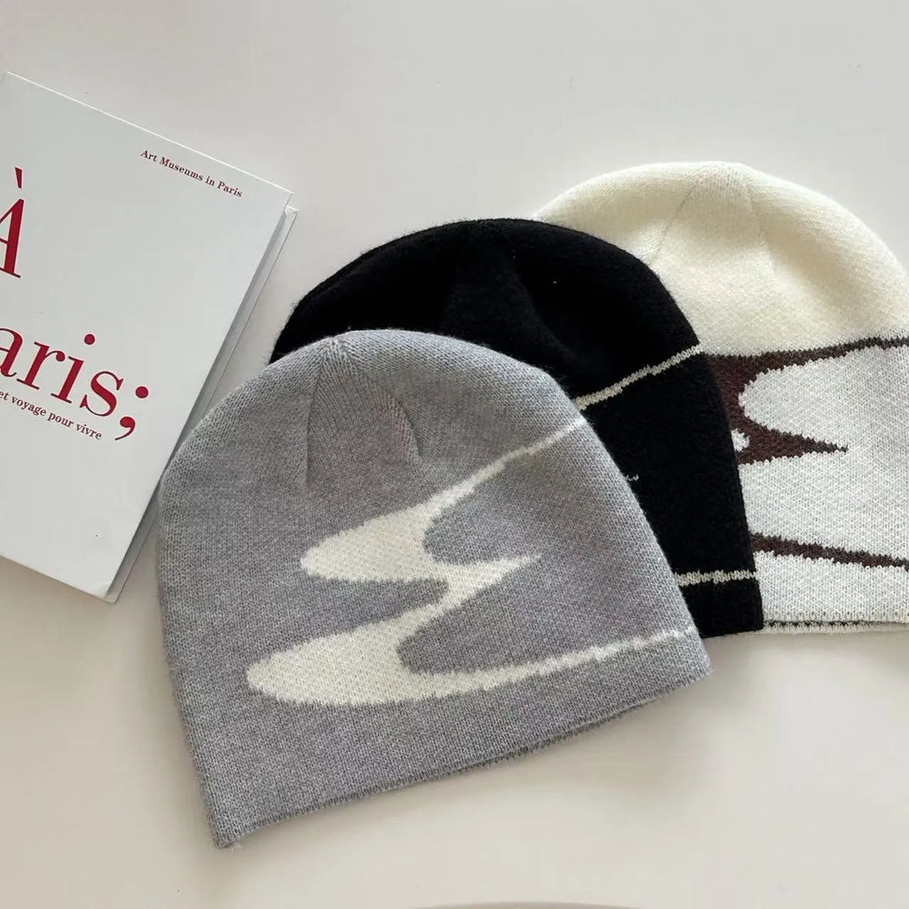 Acrylic thermal beanie hat in white colour showing woolen-style knitting texture