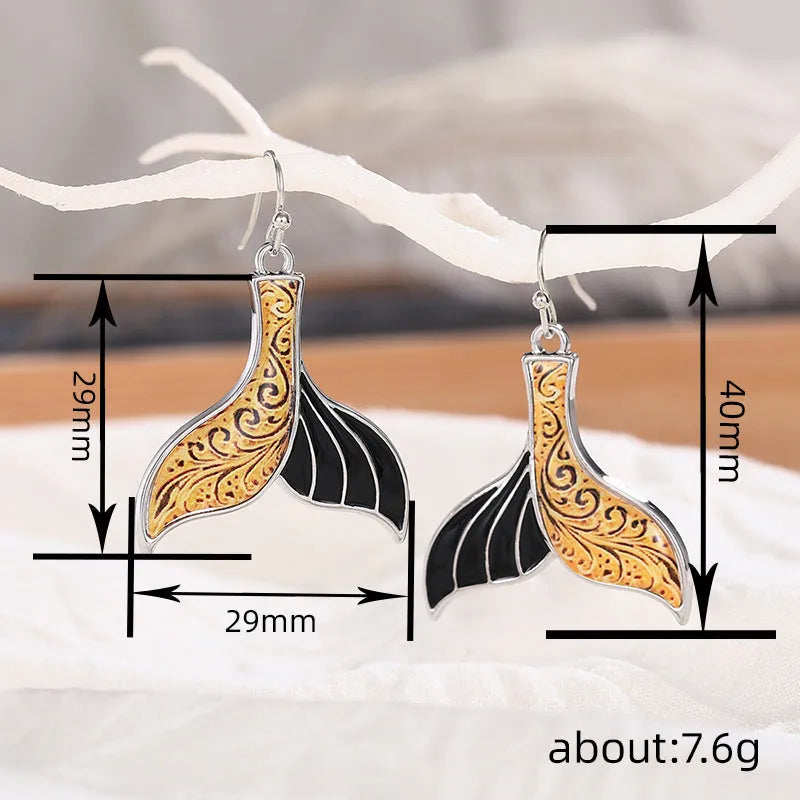 Women's fishtail shaped earrings with whale design in white gold colour alloy