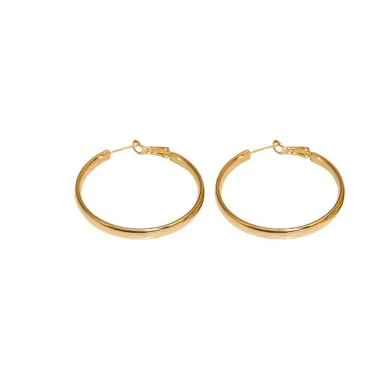 A pair of circular metal earrings with a gold electroplated finish, measuring 40mm.