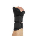 Black carbon fibre sports wrist guard with grey edging and adjustable thumb strap on athletic hand