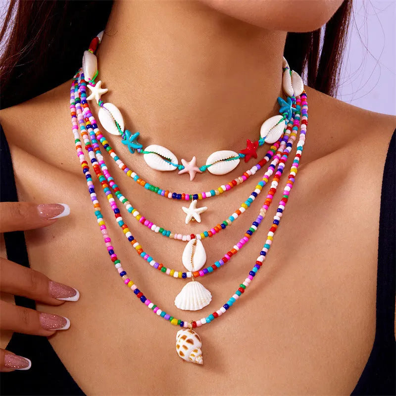 Women's starfish shell bead necklace 5-piece set with electroplated alloy pendants showing blue and mixed colour variations