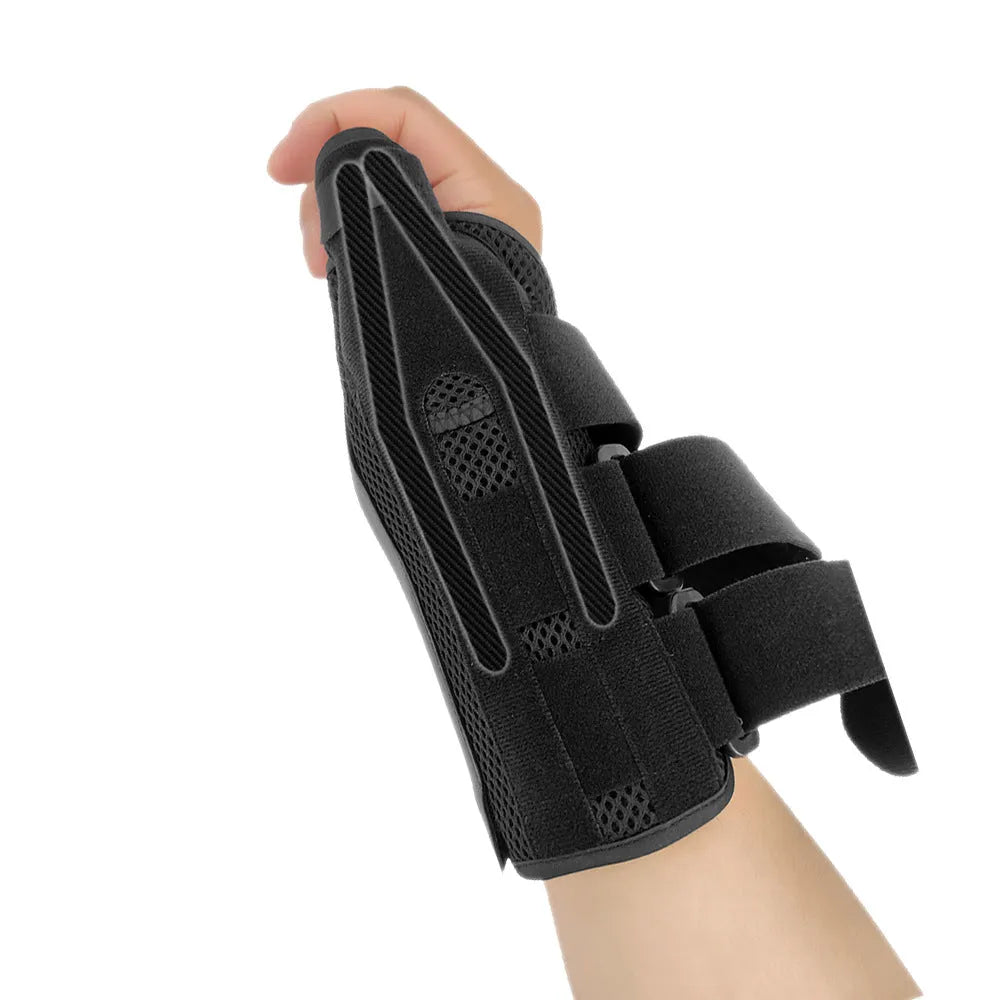 Black carbon fibre sports wrist guard with grey edging and adjustable thumb strap on athletic hand
