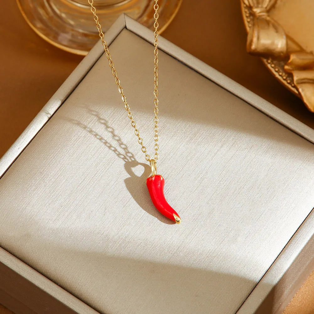 Titanium steel necklace with O-ring chain and a delicate cherry pendant in a gold-tone finish.