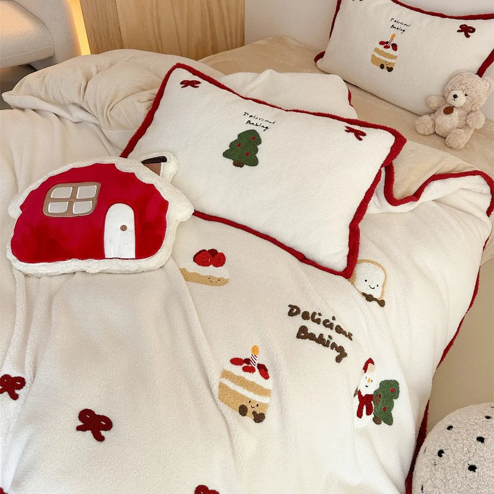 Winter Christmas cartoon patterned four-piece bedding set showing duvet cover, bed sheet, and pillowcases on a bed.