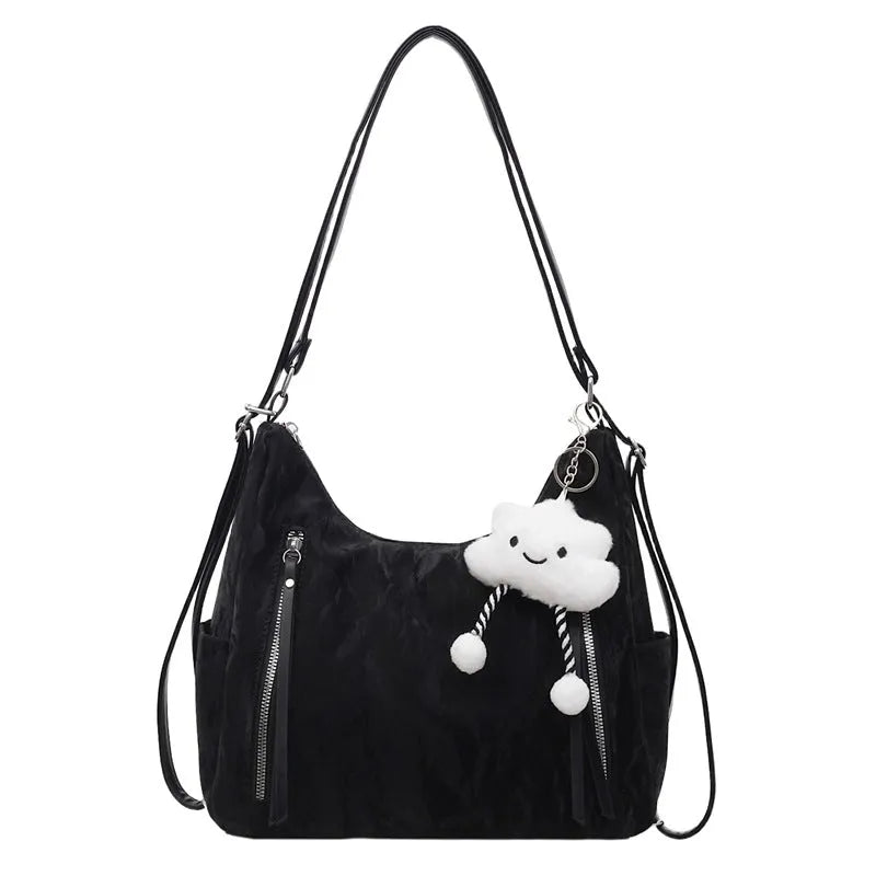 Soft PU women's fashion backpack in blue colour with a matching pendant.