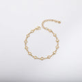 Stainless steel heart-shaped bracelet with a gold-plated finish on a wrist, showing the 17+5cm adjustable chain.