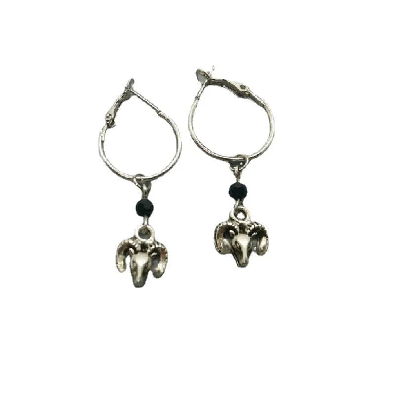 Silver alloy women's earrings with round ring design and Tibetan antelope motif.